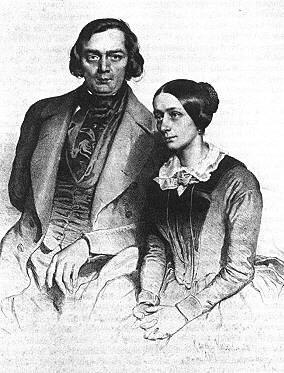 black and white daguerrotype portrait of Robert and Clara Schumann, sitting next to each other. Robert looks at the camera, Clara does not.