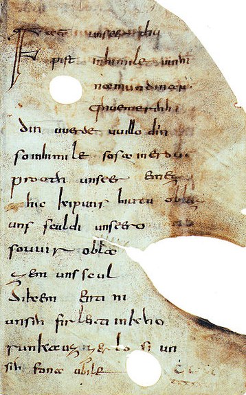 Old and partly damaged parchment with the Our Father prayer Old High German writing.